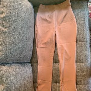 Brand new. Skinny trousers with slits at bottom